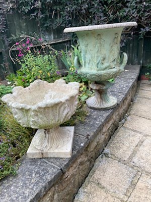 Lot 407 - Two weathered classical style garden urns.