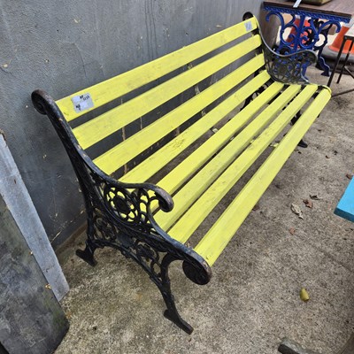 Lot 420 - A yellow painted garden bench.