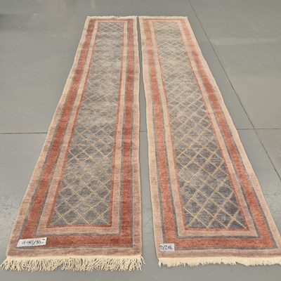 Lot 902 - Two Tibetan hand woven runners, 396 x 83cms (2)