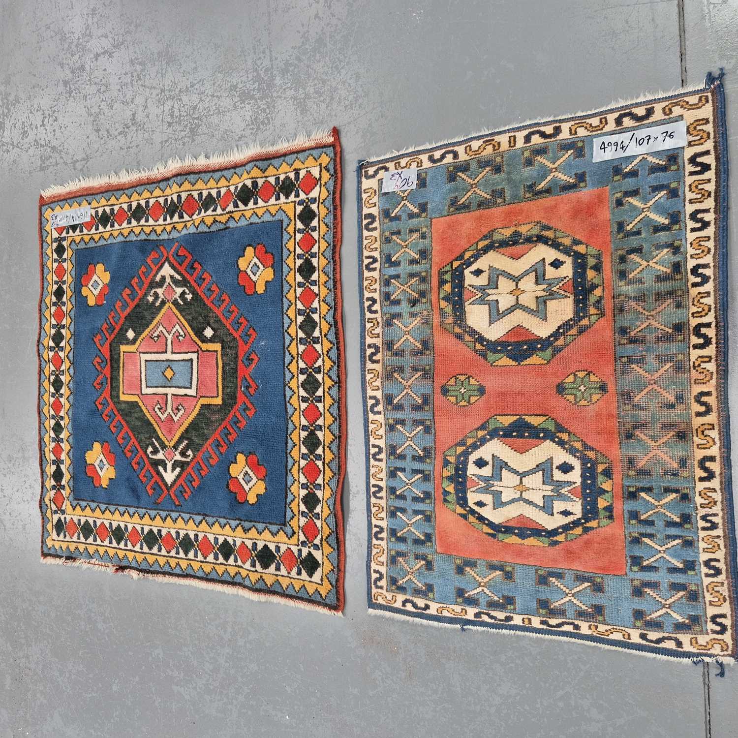 Lot 909 - Three Turkish tribal rugs, largest 225 x