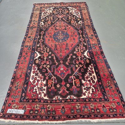 Lot 914 - A Persian tribal rug, 305 x 156cms