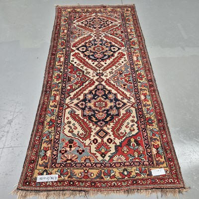 Lot 917 - An old Perian tribal rug, 296 x 130cms