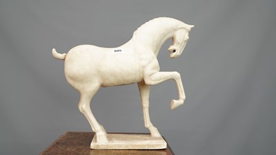 Lot 605 - A Chinese Tang style terracotta horse prancing...