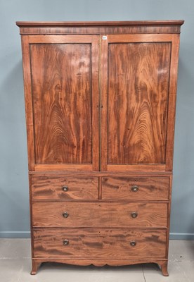 Lot 641 - An early 19th-century mahogany linen press...
