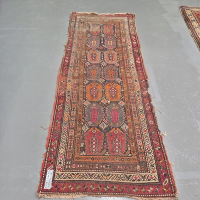 Lot 1754 - An antique Caucasion tribal runner, 260 x 98cms