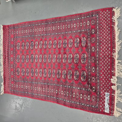 Lot 1760 - An Oriental rug of Bokhara design, 192 x 128cms