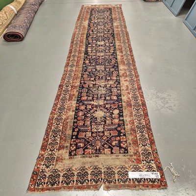 Lot 1764 - An antique Persian Karadja runner, 442 x 101cms