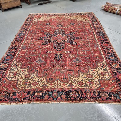 Lot 1769 - An antique Persian Heriz carpet, 350 x 240cms
