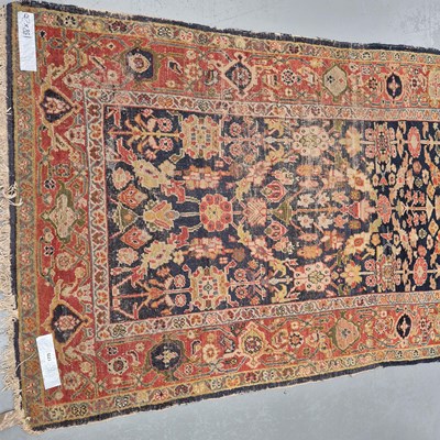 Lot 1775 - An antique Persian Zeigler Sultanabad rug, 210...