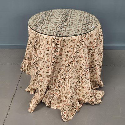 Lot 647 - A pair of bedside tables with draped fabric...
