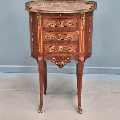 Lot 330 - A small French parquetry inlaid oval marble...