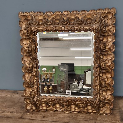 Lot 410 - An antique carved baroque style giltwood...