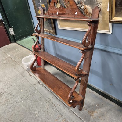 Lot 663 - An early 19th-century waterfall wall shelf....