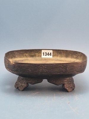 Lot 1344 - An archaic Chinese bronze rounded rectangular...