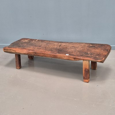Lot 1354 - An antique rustic low bench on morticed square...