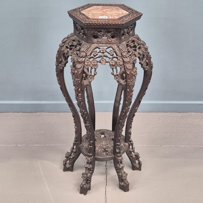 Lot 1356 - An antique chinese hardwood urn stand the top...