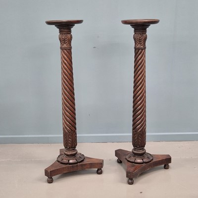 Lot 1359 - A pair of Victorian mahogany torchere, with...