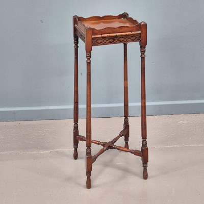 Lot 675 - A Georgian style mahogany kettel stand with...
