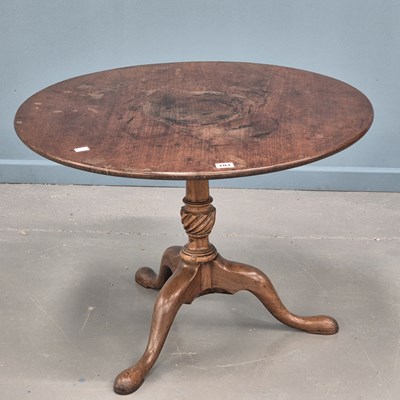 Lot 701 - A George III mahogany tilt top tripod table,...