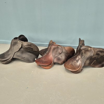 Lot 740 - Three vinatge leather horse saddles, a leather...