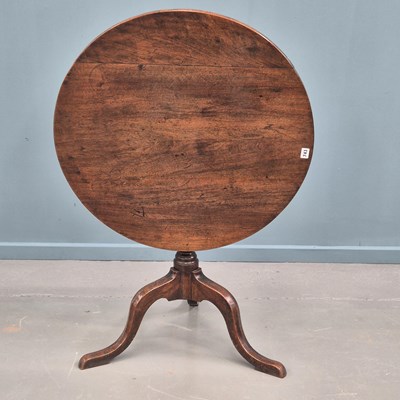 Lot 743 - A George III mahogany tripod table on shaped...