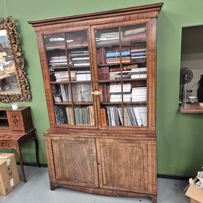 Lot 767 - A George III mahogany bookcase with glazed...