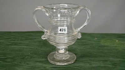 Lot 476 - An antique glass twin-handle large cup with a...