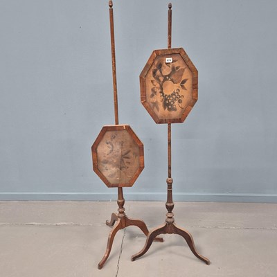 Lot 474 - A pair of antique mahogany pole screens,...