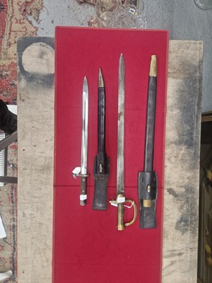 Lot 1881 - A 19th-century Baker-type bayonet, together...