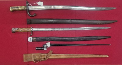 Lot 1886 - A Russian Nagant bayonet, A French Chassepot...