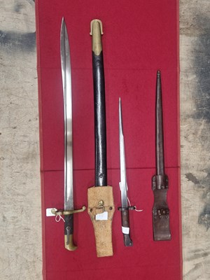 Lot 1891 - An 1895 Mannlicher bayonet with frog, and an...