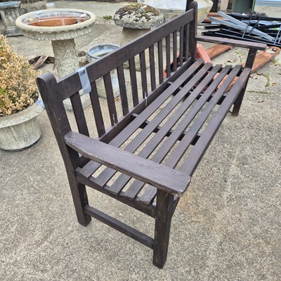 Lot 1088 - a teak garden bench
