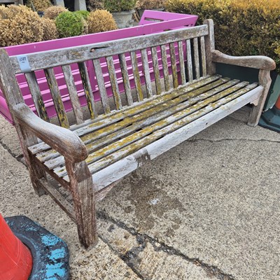 Lot 1089 - A teak garden bench