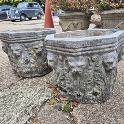 Lot 1090 - A pair of Octagonal garden planters with lion...