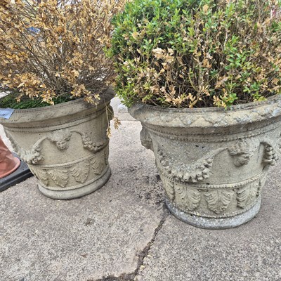 Lot 1091 - A pair of large classical style terrace urns...