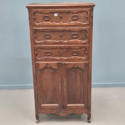 Lot 1386 - An antique French oak chest of three drawers...
