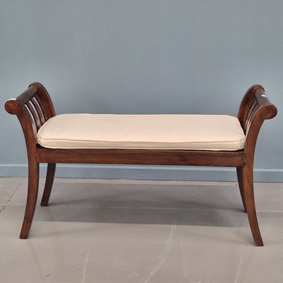 Lot 1389 - A vintage teak window seat bench. 107 cm wide.