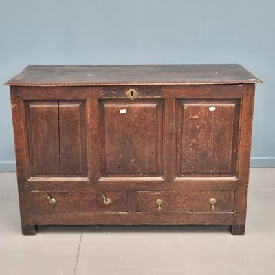 Lot 1390 - An 18th-century oak panel front mule chest....