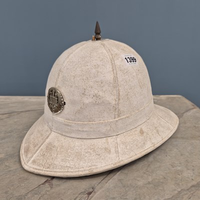 Lot 1399 - A vintage Pith helmet.