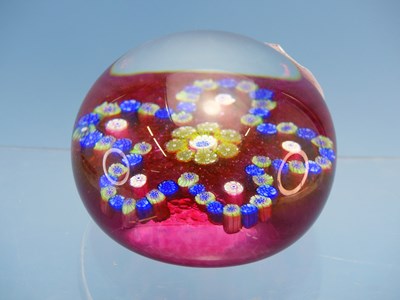 Lot 1304 - A Vintage cranberry ground glass paperweight...
