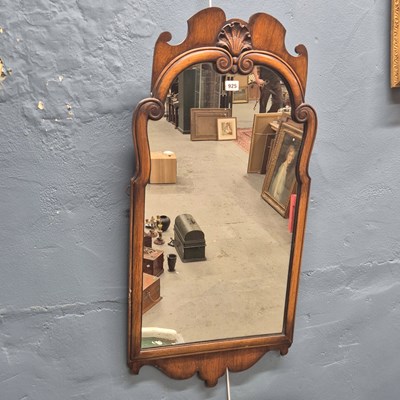 Lot 925 - A 20th century walnut cutwork framed mirror,...