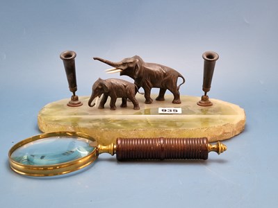 Lot 935 - A green onyx inkstand supporting two bronze...