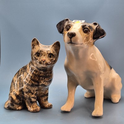 Lot 953 - A pair of Winstanley pottery seated terriers...