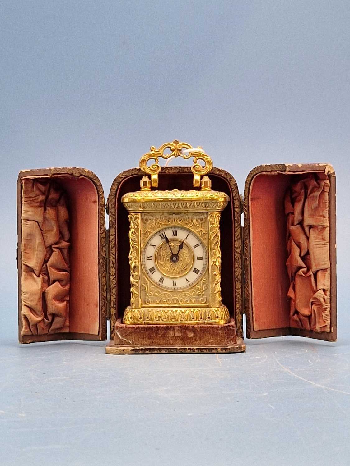 Lot 954 - A cased miniature carriage timepiece housed in...