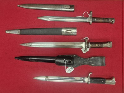 Lot 1910 - A German parade dagger, a Bulgarian bayonet...