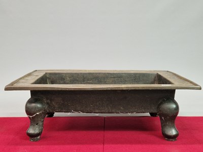 Lot 1002 - An Early Chinese Bronze planter, the outer rim...