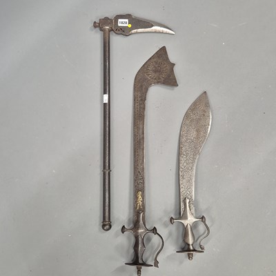 Lot 1828 - Two Indian iron short swords (Kharga) with...