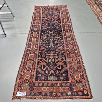 Lot 576 - An antique Persian Hamadan runner, 295 x 107cms