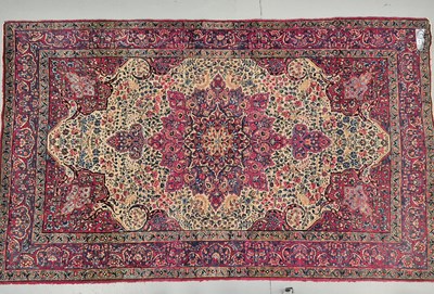 Lot 579 - An antique Persian Kirman rug, L 227 W 138cms