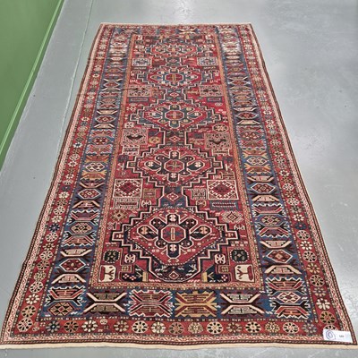 Lot 585 - An unusually large antique Caucasian rug,...